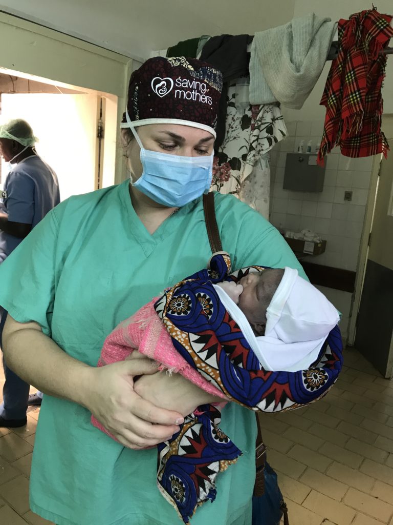 Medical staff holds baby
